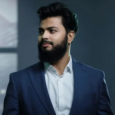 Md Farid Ahmed, founder of TreemanSites, in a navy suit